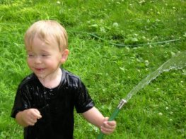 photo: boy with hose